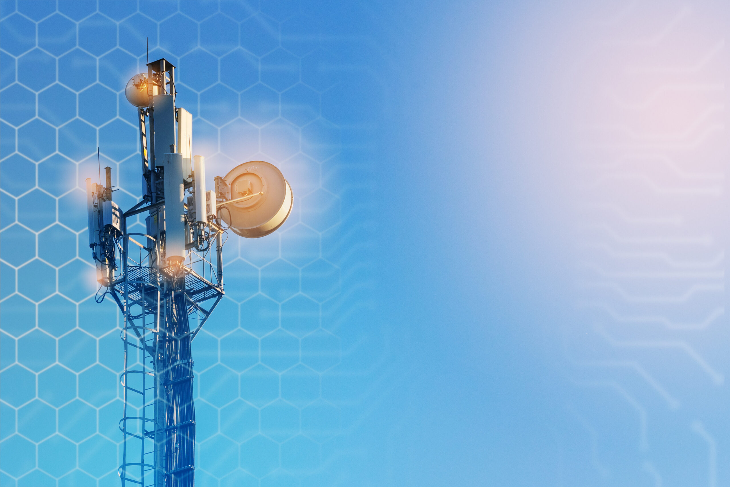 5g wireless tower with blue sky and grid